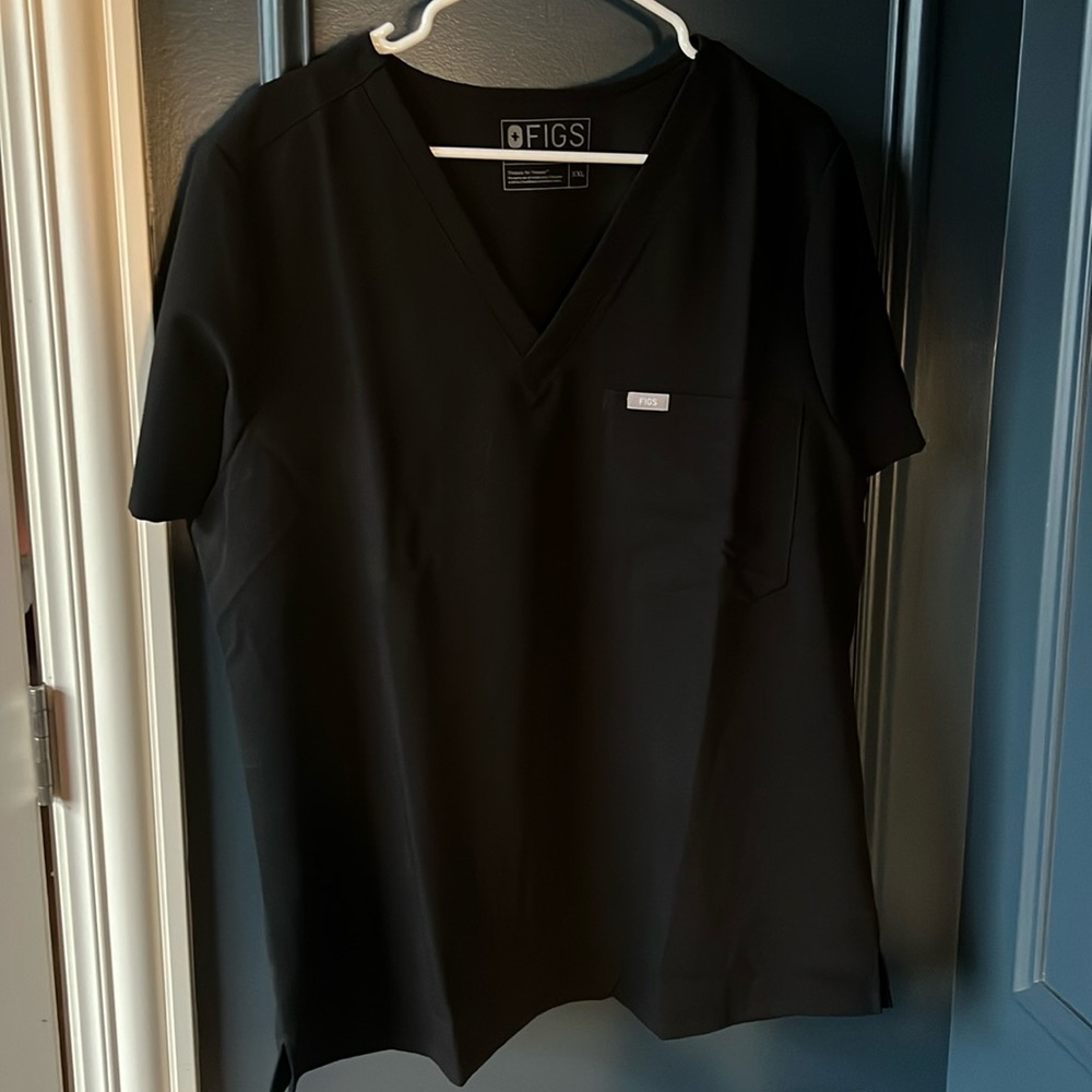Never worn. Men’s figs scrub top.